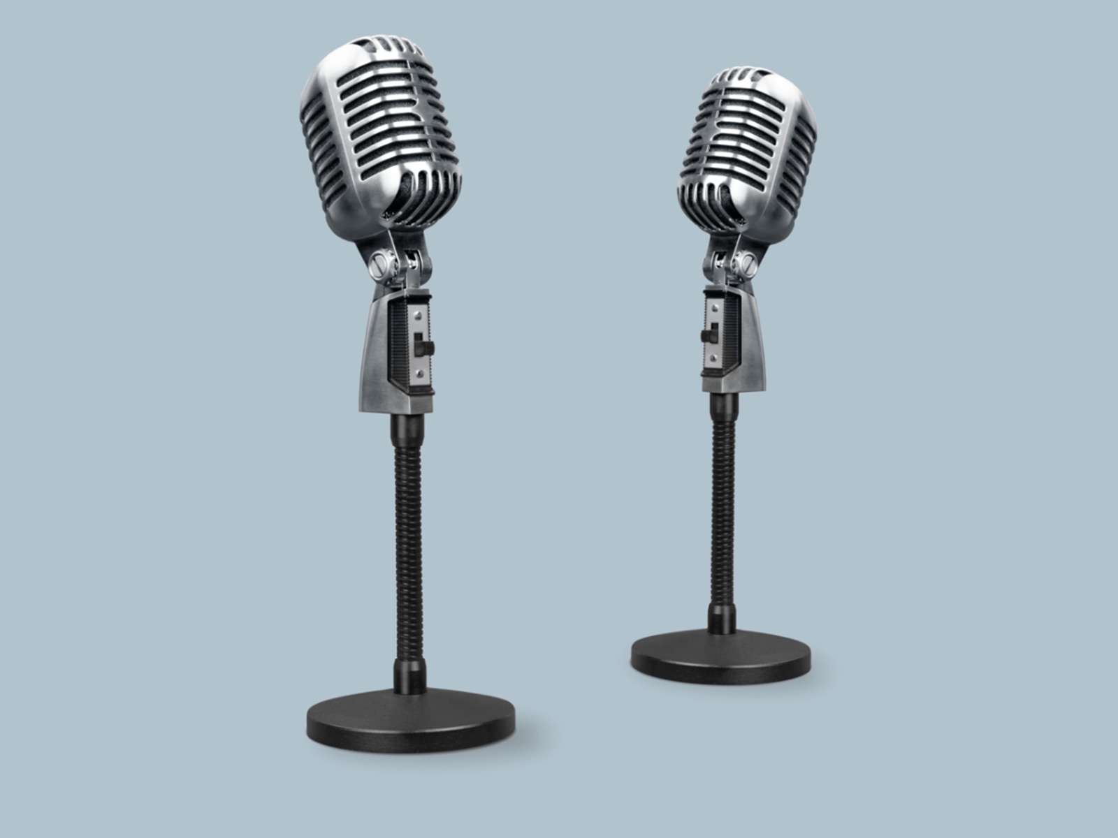 Image of two old school microphones