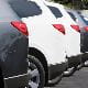 row of car boots SUVs grey white silver