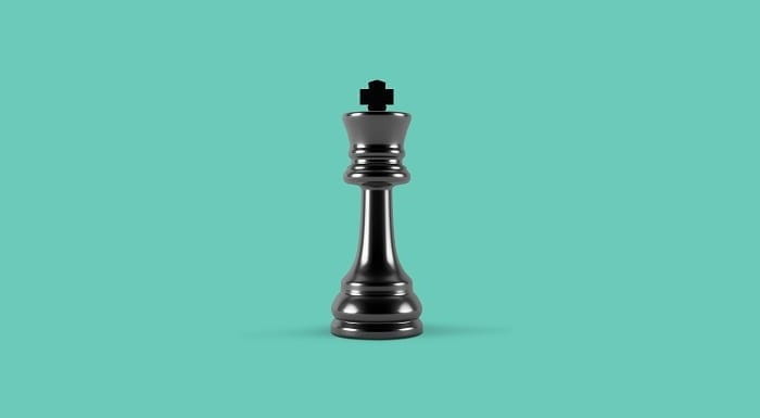 Chess piece on a teal background