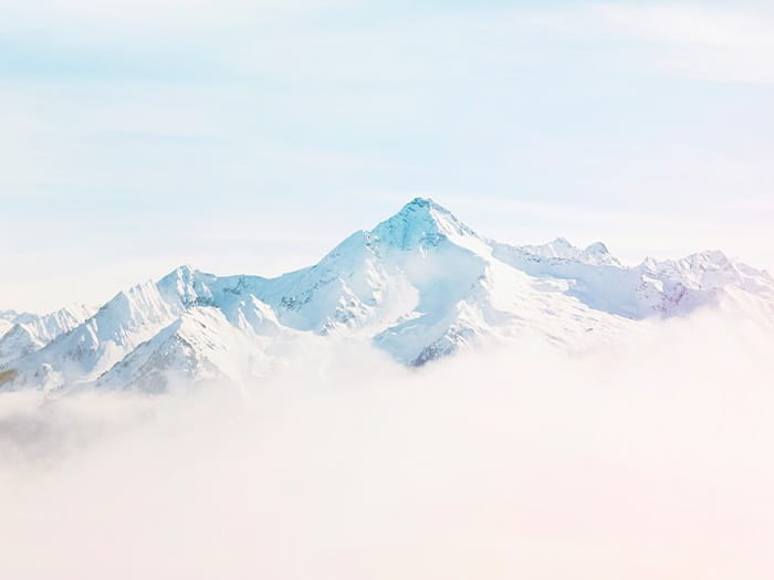 snow mountains peaks sky cloud ICAEW Corporate Financier comment interest rates